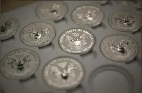  ?? Scott Eells/Bloomberg ?? One-ounce silver Liberty coins at the United States Mint at West Point, N.Y., in 2013.