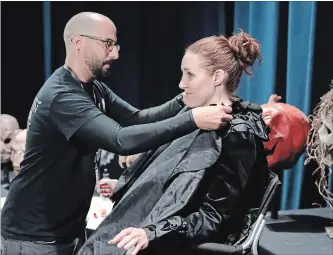  ?? JOHN RAOUX PHOTOS THE ASSOCIATED PRESS ?? Makeup artist Eric Garcia, left, starts the process of turning “scare-actor” Laura Law into a witch, which takes him an hour. “People don’t think it’s a real thing,” Law said, “but you can smell the fear in people a little bit.”