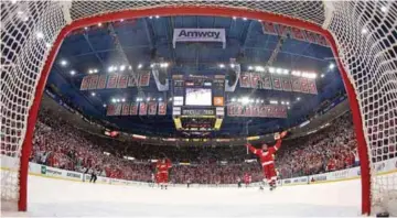  ?? — A FP ?? DETROIT: Henrik Zetterberg #40 of the Detroit Red Wings celebrates an empty net goal by teammate Daniel Cleary #11 late in the third period while playing the Chicago Blackhawks in Game Four of the Western Conference Semifinals.