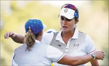  ?? CHARLIE NEIBERGALL — THE ASSOCIATED PRESS ?? U.S. players Lexi Thompson, right, and Cristie Kerr celebrate their four-ball victory at the Solheim Cup on Saturday.