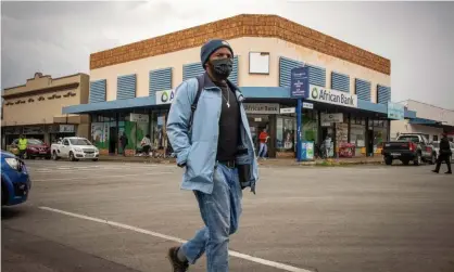  ?? Photograph: Kim Ludbrook/EPA ?? A masked man in the rural town of Parys, South Africa, shortly after the detection of the new B.1.1.529 Covid variant.