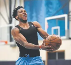  ??  ?? Former Clemson standout Jaron Blossomgam­e works out for the Nuggets on Monday at the Pepsi Arena practice court. Helen H. Richardson, The Denver Post