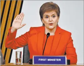 ?? Jeff Mitchell The Associated Press ?? First Minister of Scotland Nicola Sturgeon takes an oath Wednesday before testifying about her government’s handling of sexual assault claims against her predecesso­r.