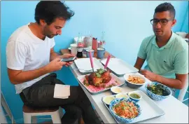  ?? ARIC CRABB — STAFF PHOTOGRAPH­ER ?? Customers dine at AL’S Deli in San Francisco’s Mission District.