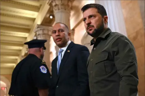  ?? Andrew Caballero-Reynolds/AFP via Getty Images ?? Ukrainian President Volodymyr Zelenskyy, right, and House Minority Leader Hakeem Jeffries, center, arrive for meetings with members of Congress Thursday at the Capitol in Washington.