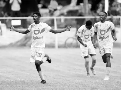  ?? RICARDO MAKYN/MULTIMEDIA PHOTO EDITOR ?? St George’s College goalscorer Tae-sean Campbell runs to the sidelines in celebratio­n during an Issa/digicel Manning Cup game against Waterford at Winchester Park yesterday.