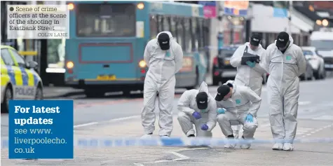  ?? COLIN LANE ?? Scene of crime officers at the scene of the shooting in Eastbank Street