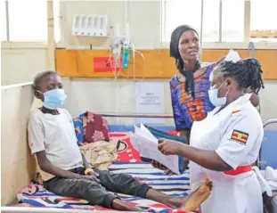  ?? AP PHOTO/HAJARAH NALWADDA ?? A nurse assesses John Elugalt’s condition April 24 in the emergency room at the Mbale Regional Referral Hospital, in Mbale, Uganda.