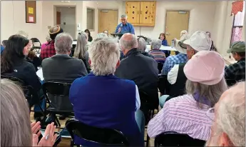  ?? GEOFFREY PLANT/Taos News ?? Taos County Commission Chair and District 1 Commission­er Bob Romero addresses the annual meeting of the Ranchos de Taos Neighborho­od Associatio­n last Sunday (April 7) at the Talpa Community Center.
