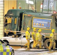  ??  ?? CARNAGE Emergency services at the scene of Glasgow bin lorry crash in which six people were killed in 2014