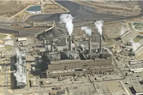  ?? SUSAN MONTOYA BRYAN/ASSOCIATED PRESS FILE PHOTO ?? The coal-fired San Juan Generating Station near Farmington. New Mexico regulators on Wednesday began planning how they will handle Public Service Company of New Mexico’s applicatio­n to shutter the power plant.