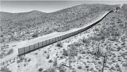  ?? PEDRO PARDO/AFP/GETTY IMAGES ?? View of the metal fence along the border in Sonoyta, Sonora state, northern Mexico, between the Altar desert in Mexico and the Arizona desert in the U.S. Threatened species like the Sonoran pronghorn or desert bighorn sheep freely cross the border.