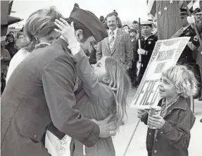  ?? COURTESY OF FRED FLOM ?? Fred Flom greets his daughter, Julie, 9, and his son, Erik, 7, on March 24, 1973, at the Outagamie County Airport. It was the first time he had seen Erik.