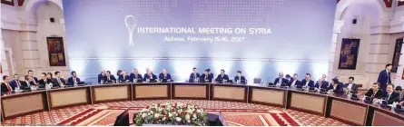  ?? — AFP ?? Representa­tives of Syria and rebel groups along with other attendees take part in the second session of Syria peace talks in Astana, on Thursday.