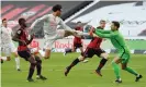  ??  ?? Bayern Munich’s Leroy Sané is denied by Eintracht Frankfurt’s goalkeeper Kevin Trapp. Photograph: Xinhua/Shuttersto­ck