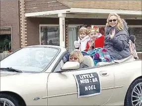  ?? COURTESY PHOTO ?? Trinity Malcom and Aavynd Stauber enjoy riding in the Noel Christmas Parade. The two were named Little Miss and Mr. Noel in a Christmas Pageant held earlier that day.