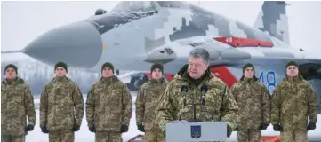  ??  ?? Poroshenko addresses servicemen of the 40th Tactical Aviation Brigade of the Ukrainian Armed Forces at an airbase in Vasylkiv near Kiev. — Reuters photo