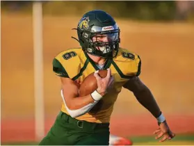  ?? Greg Jungferman / MaxPreps ?? San Marin-Novato two-way standout Justin Guin, one of The Chronicle’s Co-Metro Players of the Year, helped the Mustangs win the 5-AA state title.