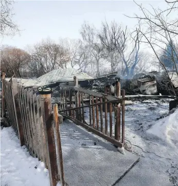  ?? MICHELLE BERG ?? A fire Tuesday morning tore through this century-old farmhouse outside Saskatoon. Don Agar, owner of Agar’s Corner, plans to begin rebuilding the historic venue after the cleanup concludes.