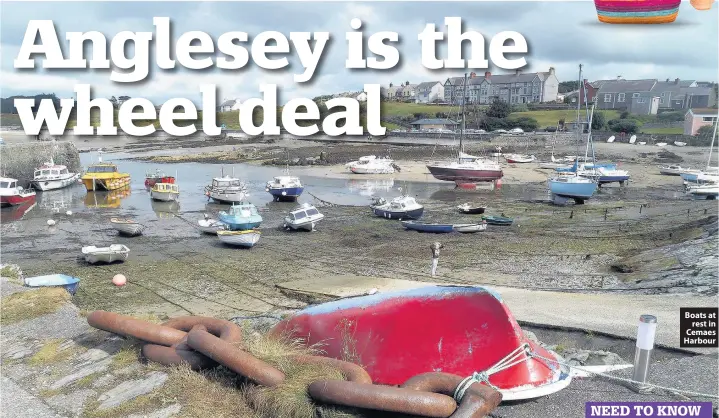  ??  ?? Boats at rest in Cemaes Harbour