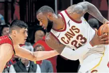  ?? GETTY IMAGES FILES ?? Cleveland Cavaliers’ forward LeBron James looks to drive against Ersan Ilyasova, of the Atlanta Hawks, at Philips Arena, on Nov. 30, in Atlanta.