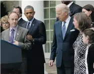  ?? WIN MCNAMEE/ GETTY IMAGES ?? Mark Barden, father of a Sandy Hook victim, joins U.S. President Barack Obama and Vice-President Joe Biden.
