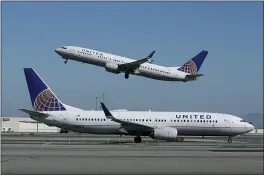  ?? JEFF CHIU — THE ASSOCIATED PRESS FILE ?? A United Airlines flights at San Francisco Internatio­nal Airport in San Francisco. United says it will train 5,000pilots at its own academy in this decade, and it hopes that half of them will be women or people of color.
