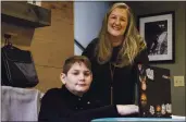  ?? BEN GRAY — THE ASSOCIATED PRESS ?? Kelli Rivera with her son Tate, 11, at their home in Roswell, Ga., Friday. Rivera is hoping a voucher bill passes that will help pay for her to move her son out of a public Cobb County school and into a private school.