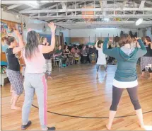  ??  ?? Drummers become dancers in the Scout Hall at Dannevirke Domain.