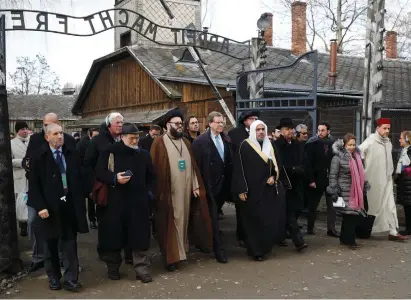  ?? (Kacper Pempel/Reuters) ?? MOHAMMAD AL-ISSA, secretary-general of the Muslim World League, and David Harris, CEO of the American Jewish Committee, visit the former Nazi concentrat­ion and exterminat­ion camp Auschwitz I in Oswiecim, Poland, January 23, 2020.