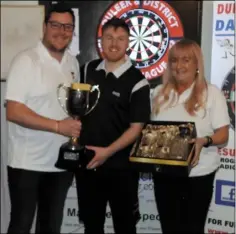 ?? ?? Dylan Powell, winner of the Duleek & District League’s Kevin Campbell Memorial Singles, with league committee members Robert Smith and Paula Kearney at the trophy presentati­on.