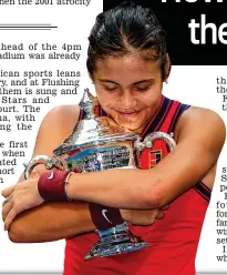  ?? GETTY IMAGES ?? Love game: Raducanu embraces the US Open trophy