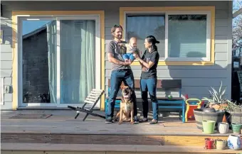  ?? York Times Co. Ilana Panich-Linsman, © The New ?? Marla Torrado and Adam Keeling with their son, Diego, and their dog, Lia, on the porch of the accessory dwelling unit behind their home in Austin, Texas, in January.