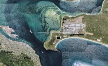  ?? PHOTO: GOOGLE UNDATED RECENT AERIAL ?? SCL stockpile at Tiwai Point (white at bottom right).