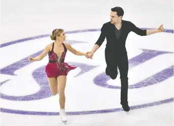  ?? JUNG YEON-JE/AFP ?? Kirsten Moore-towers and Michael Marinaro of Canada were scheduled to compete in front of a home crowd at the World Figure Skating Championsh­ips in Montreal until the event was cancelled Wednesday.