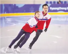  ?? — AFP photo ?? Figure skaters RyomTae-Ok (L) and Kim Ju-Sik (R) of North Korea attend a practice session at the Gangneung Ice Arena in Gangneung on February 6, 2018 ahead of the Pyeongchan­g 2018 Winter Olympic Games.