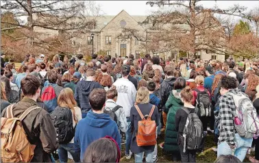  ?? SEAN D. ELLIOT/THE DAY ?? Students at Connecticu­t College rally on Tempel Green against gun violence on Thursday. The school will be on spring break in two weeks when a nationwide student walkout to protest gun violence is planned, so students organized Thursday’s event to give...