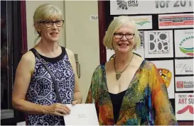  ??  ?? Margaret Koopmans (left) was awarded best still for her exhibit Fusion Cooking. She is pictured with art show director Kay Lancashire.