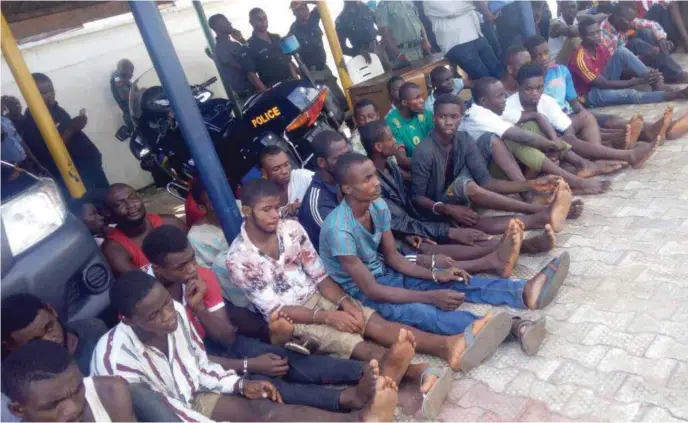  ??  ?? A cross section of 35 arrested cultists paraded by the police