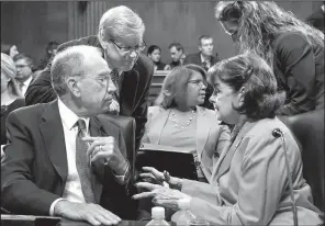  ?? AP/J. SCOTT APPLEWHITE ?? Senate Judiciary Committee Chairman Charles Grassley, R-Iowa (left) confers Thursday with Sen. Dianne Feinstein, D-Calif., at the panel’s hearing on Christophe­r Wray, the nominee to lead the FBI.