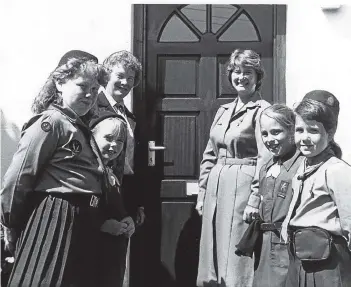  ??  ?? In July 1988, Fife Girl Guides were gifted their own cottage. It was left to them by the late Mr J. Carmichael. Pictured are the guides at their own front door in Balmullo.