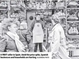  ?? Bloomberg Photo ?? A fruit seller in spain. Amid the price spike, spanish businesses and households are hurting.