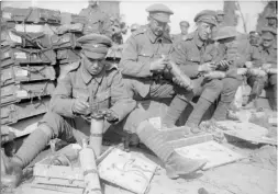  ?? (HMP) ?? ■ Right: Men of the King’s Own Yorkshire Light Infantry fuse Stokes mortar shells near Wieltjie, 1 October 1917.