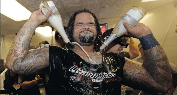  ?? — THE ASSOCIATED PRESS ?? Detroit Tigers first baseman Prince Fielder soaks himself with bubbly after his squad shut out the Oakland A’s in Game 5 of the ALDS on Thursday night.