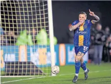  ??  ?? Jason Cummings struck twice for Shrewsbury as they held Liverpool to a 2-2 draw in the FA Cup.