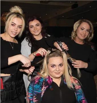  ??  ?? Chantelle Murphy getting her make up and hair done by beauty and hairdressi­ng students Shannon Browne, Aoife Flavin and Samantha Ward.