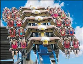  ?? STEVEN BRIDGES/ AP ?? Riders get their thrills on the Wild Eagle, a new 63- metre tall coaster at Dollywood in Tennessee. Theme parks around the U. S. are opening new attraction­s this season.