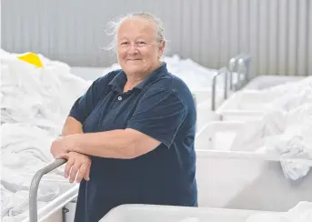  ?? Picture: Kevin Farmer ?? HAPPY DAYS: Being employed by Vanguard Laundry Services helped Vanda Storie get back on her feet and into her current job at Top of the Range Auto Gas and Mechanical.