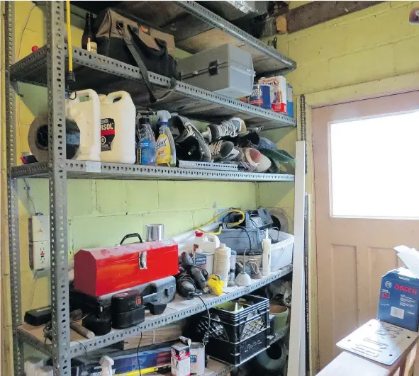  ?? — LORRAINE SOMMERFELD/DRIVING.CA ?? The clutter in Lorraine Sommerfeld’s garage carries plenty of nostalgia amid all the junk.