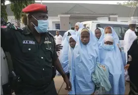  ?? (AP/Sunday Alamba) ?? Some of the students abducted by gunmen from the Government Girls Secondary School in Jangebe last week wait Tuesday for medical checkups after their release in Gusau, northern Nigeria.